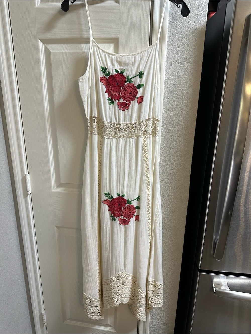 Ivory Crochet Waist and hem. Fully lined. Red Floral Embroidery
New, no tags